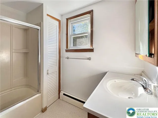 a bathroom with a sink and a bathtub