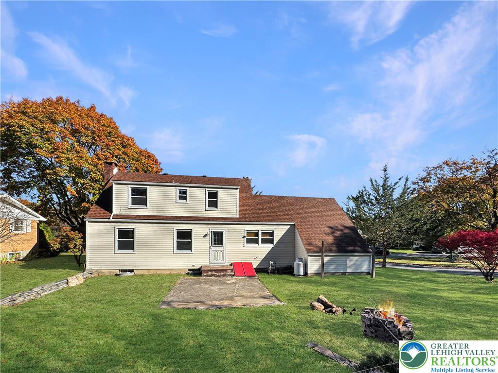 257 East 2nd Street Wind Gap, PA 18091 - Photo 14 of 14 a front view of a house with a yard table and chairs