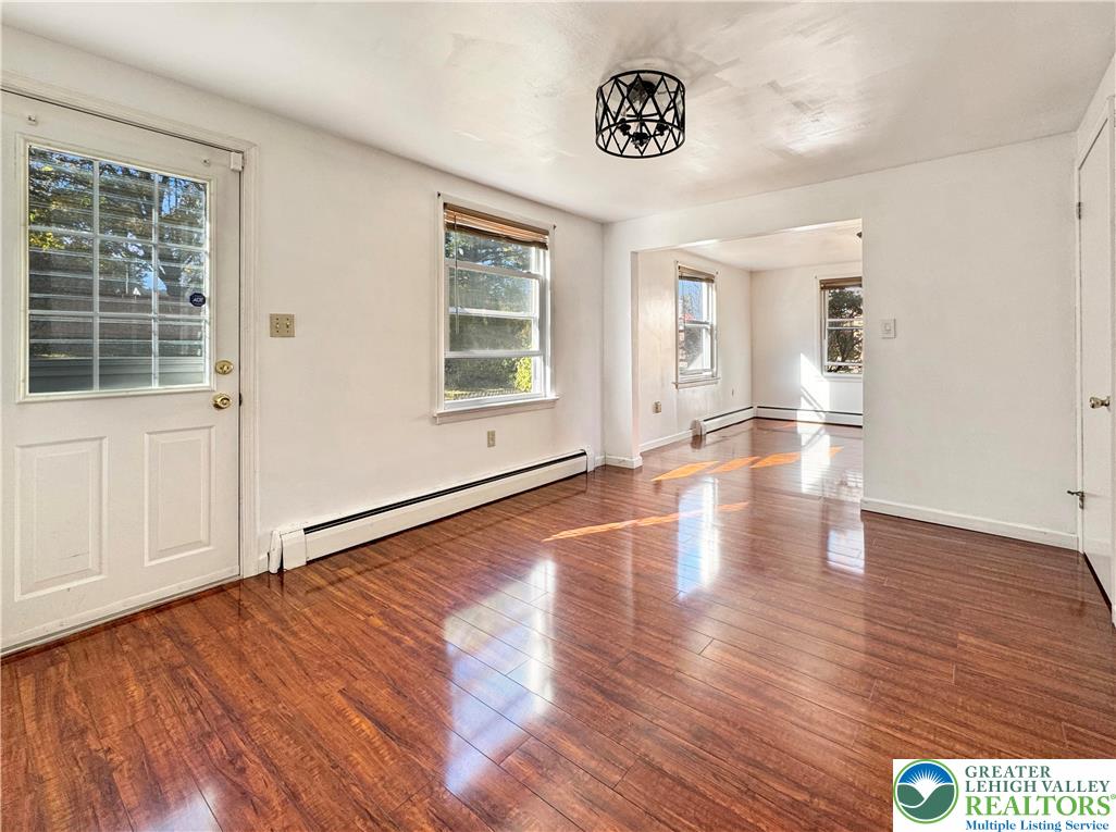 257 East 2nd Street Wind Gap, PA 18091 - Photo 3 of 14 a view of an empty room with wooden floor and a window