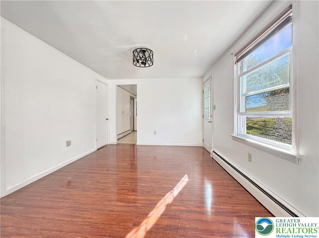 257 East 2nd Street Wind Gap, PA 18091 - Photo 4 of 14 a view of an empty room with wooden floor and a window