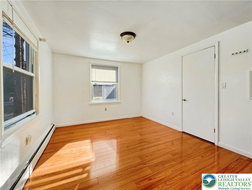 257 East 2nd Street Wind Gap, PA 18091 - Photo 10 of 14 a view of an empty room with wooden floor and a window