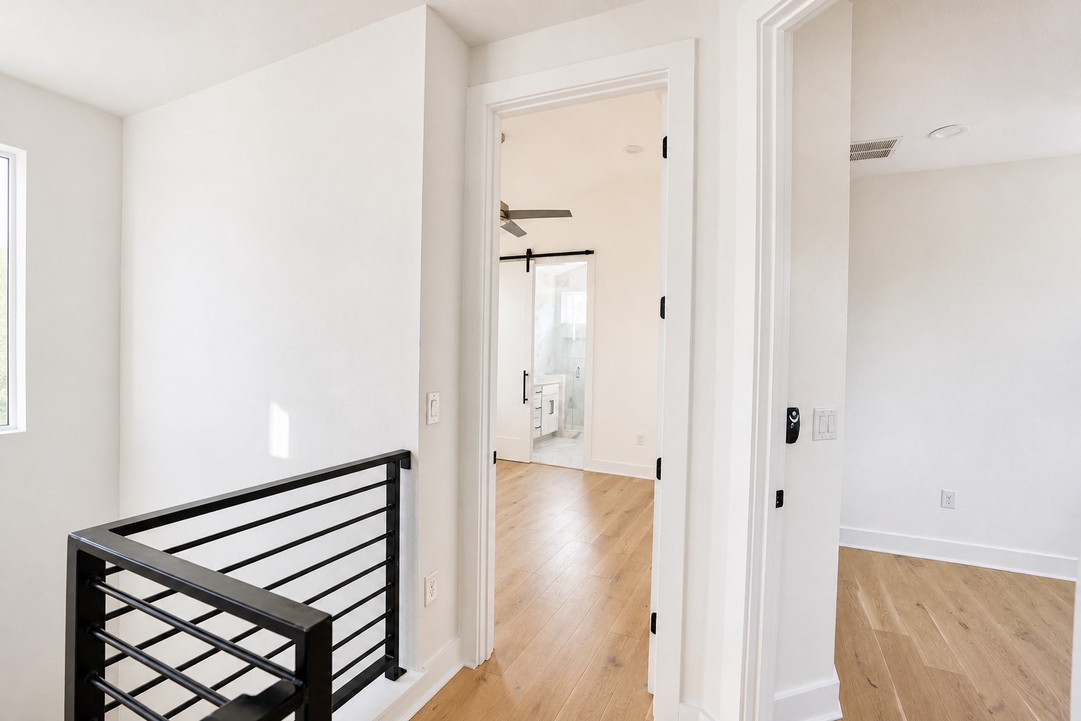 1123 Omega Avenue, Unit 1 Austin, TX 78721 - Photo 25 of 40 Light wood-finish flooring throughout the hallway