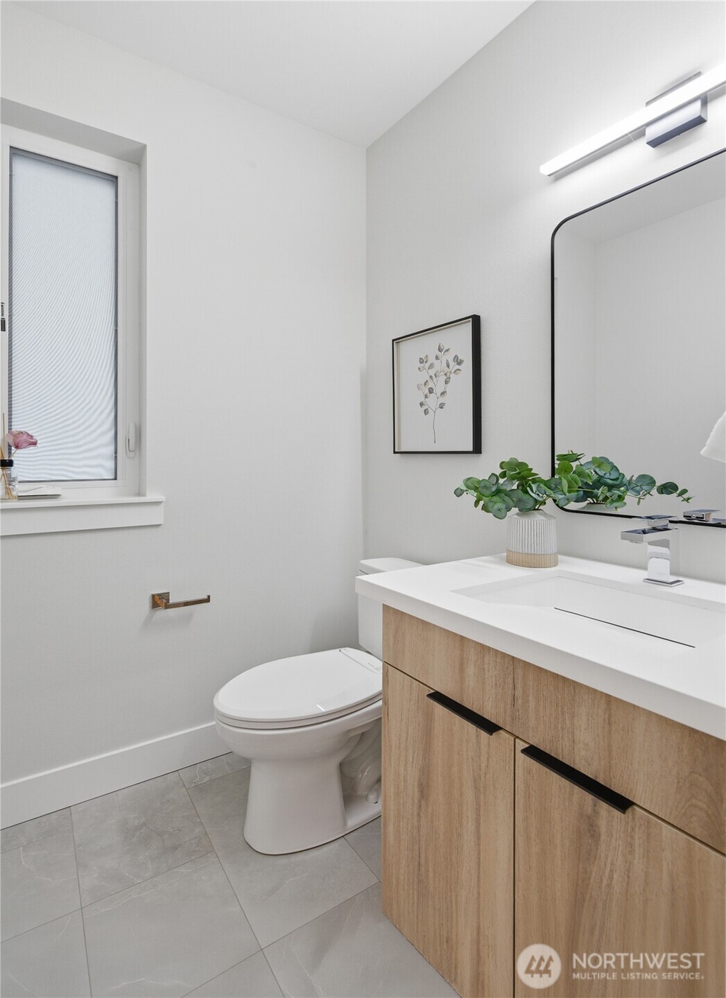 719 Edmonds Way Edmonds, WA 98020 - Photo 6 of 40 a bathroom with a sink a toilet and mirror