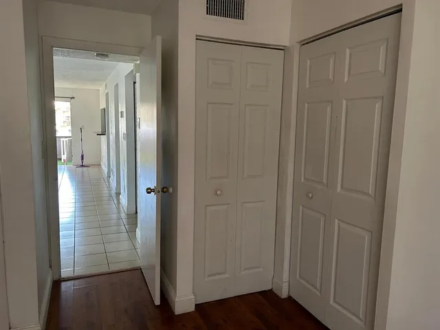 a view of a bathroom with wooden floor