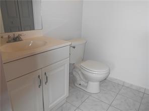 3252 Foxcroft Road, Unit 101 Miramar, FL 33025 - Photo 13 of 15 a bathroom with a toilet and a sink