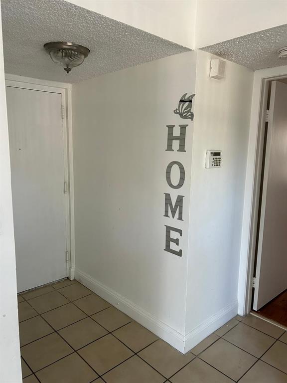 3252 Foxcroft Road, Unit 101 Miramar, FL 33025 - Photo 2 of 15 a view of an entryway with wooden floor
