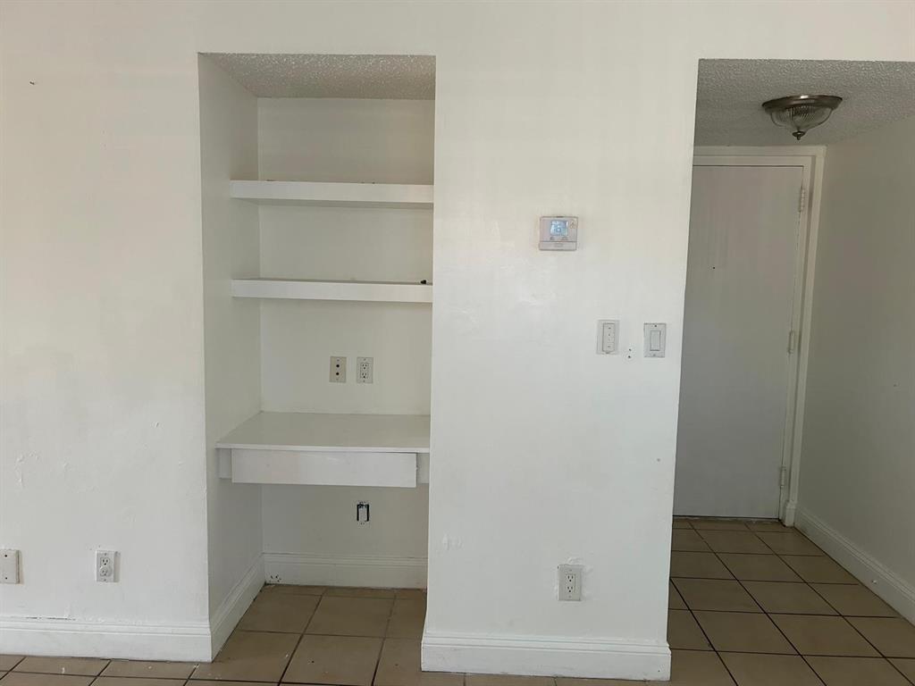 3252 Foxcroft Road, Unit 101 Miramar, FL 33025 - Photo 4 of 15 a view of walk in closet with empty racks