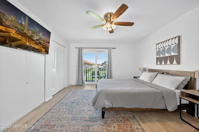 a bedroom with a large bed and a window