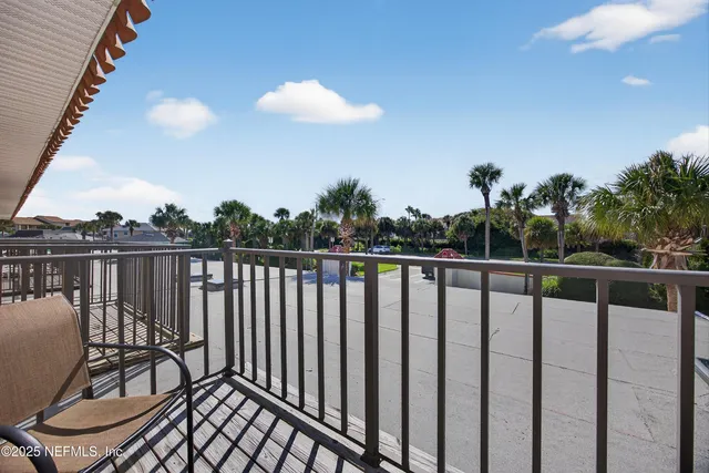 a view of a house with a backyard porch and sitting area