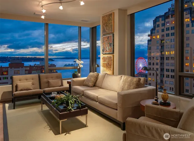 a living room with furniture and lamp