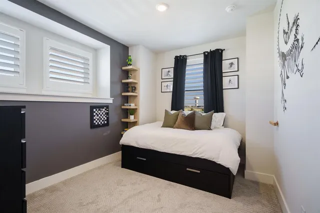 a bedroom with a bed and window