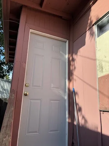 a bedroom with a bed and a flat tv screen
