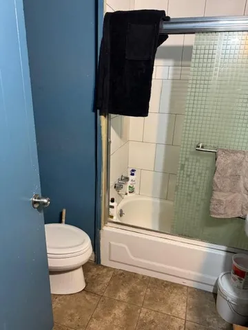 a bathroom with a sink toilet and a shower