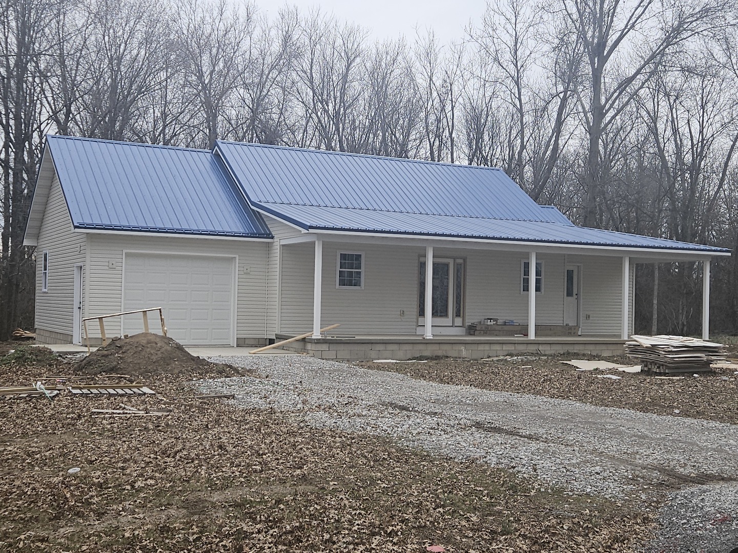 114 Evergreen Drive Ina, IL 62846 - Photo 2 of 20 a front view of a house with a garden