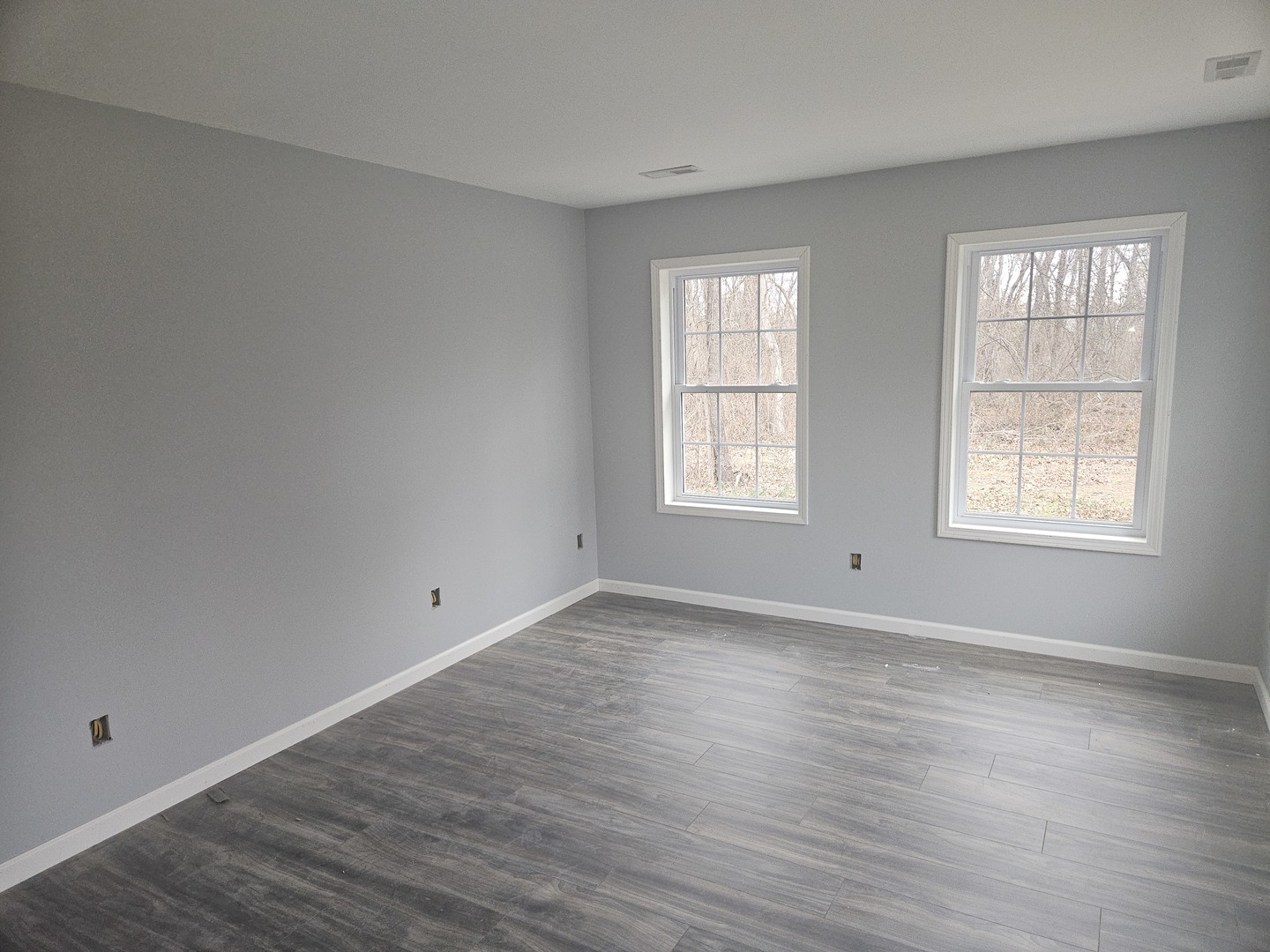 114 Evergreen Drive Ina, IL 62846 - Photo 7 of 20 an empty room with wooden floor and windows