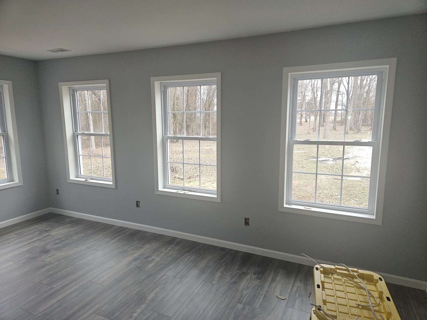 114 Evergreen Drive Ina, IL 62846 - Photo 8 of 20 a view of an empty room with wooden floor and a window