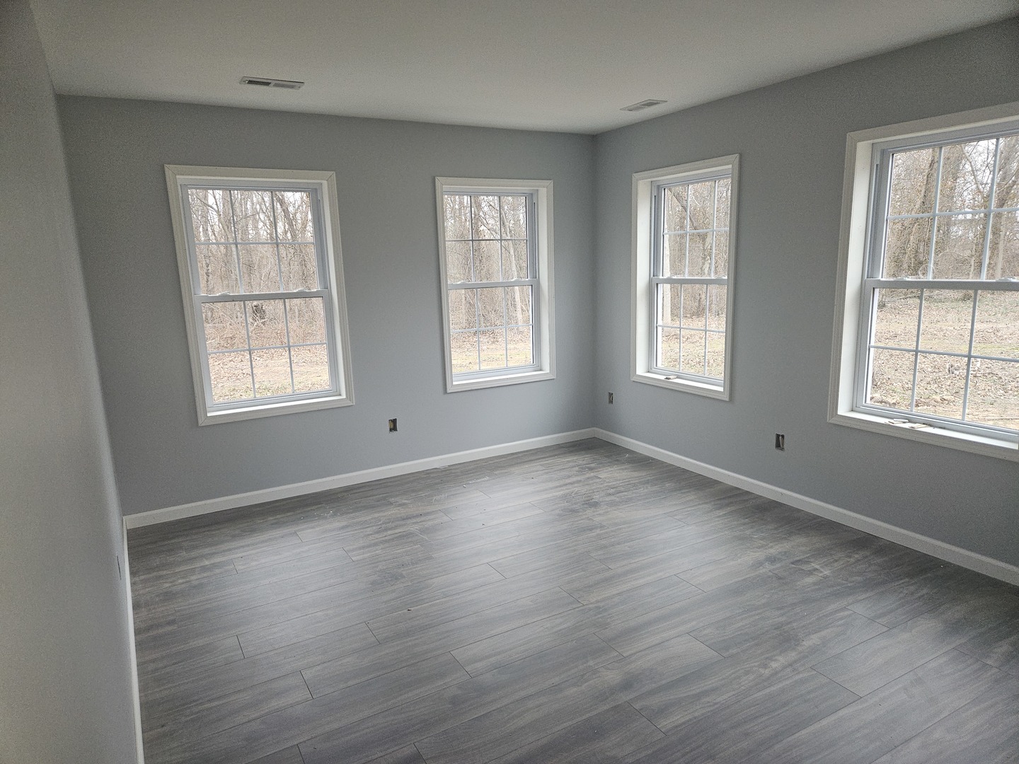 114 Evergreen Drive Ina, IL 62846 - Photo 9 of 20 an empty room with wooden floor and windows