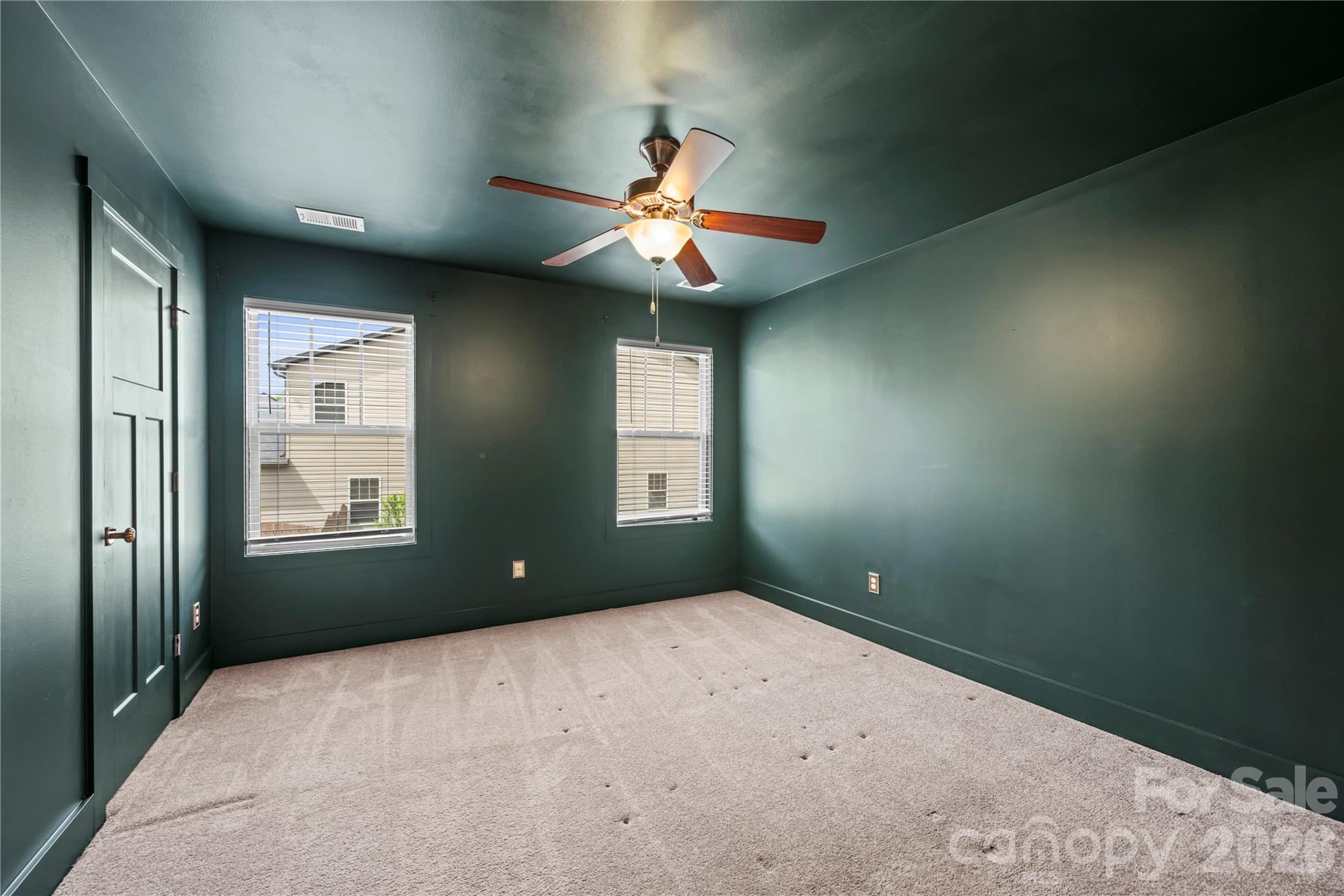 4 Henbit Way Arden, NC 28704 - Photo 25 of 38 an empty room with windows and fan