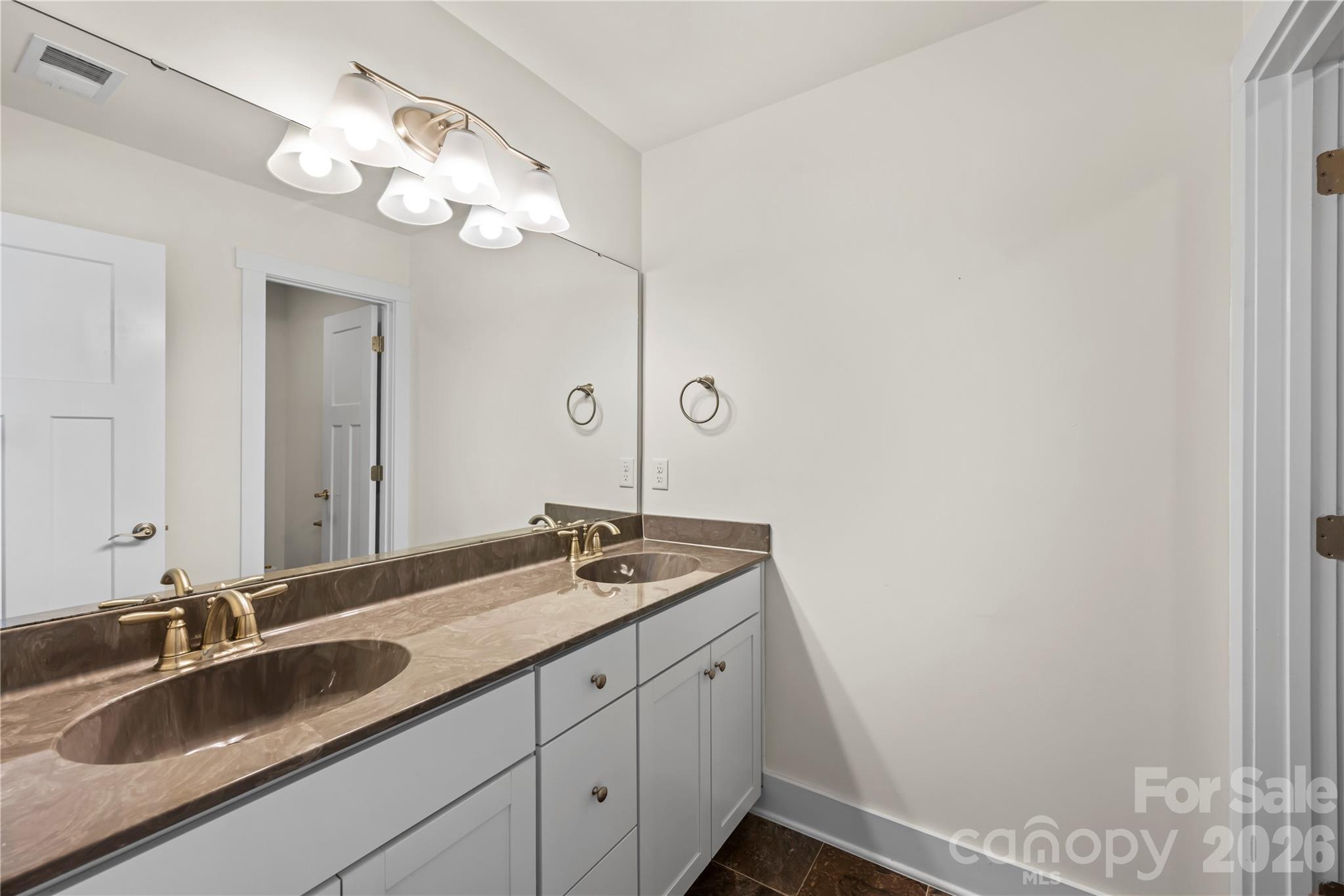4 Henbit Way Arden, NC 28704 - Photo 27 of 38 a bathroom with a sink and a mirror