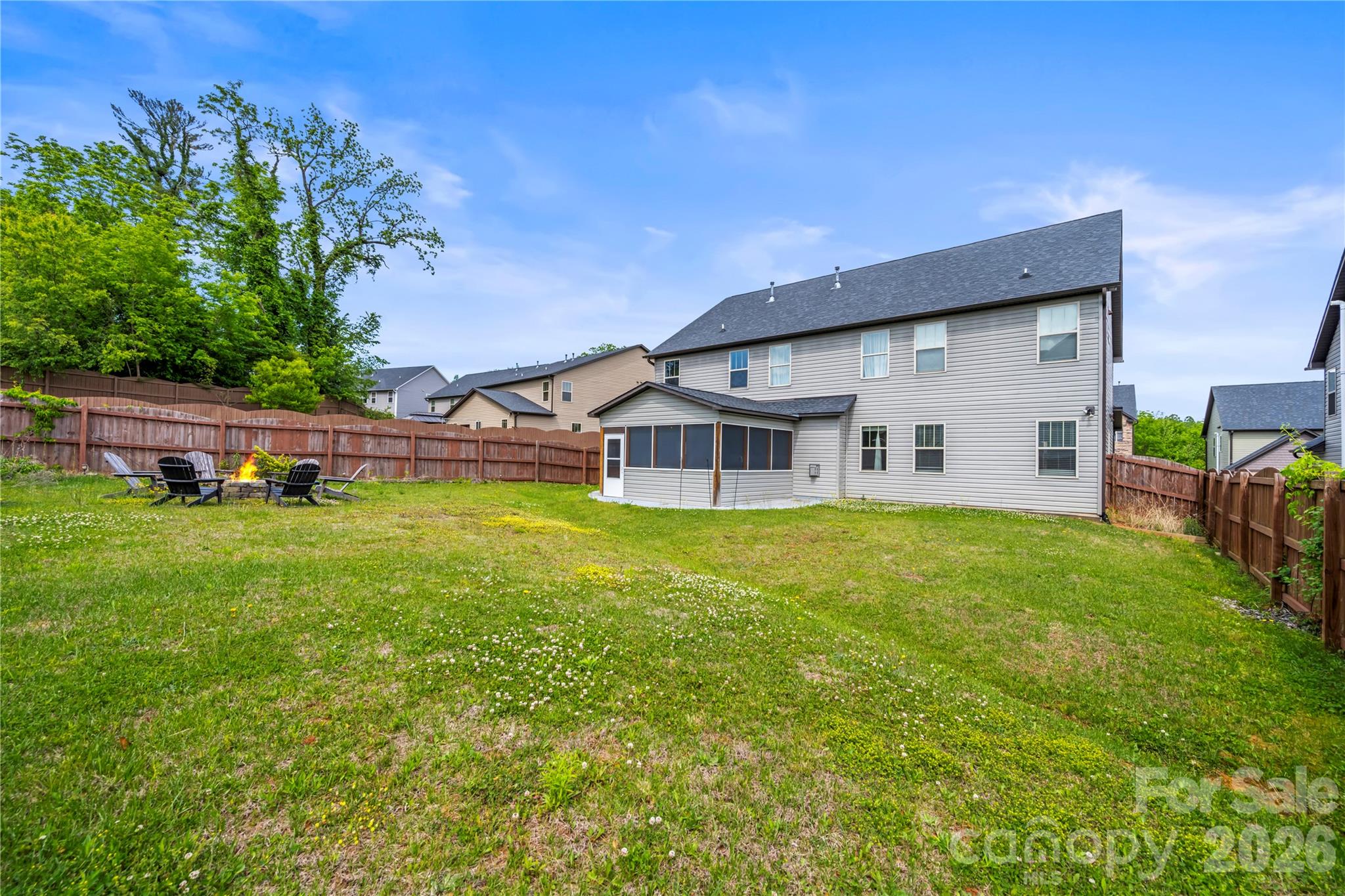 4 Henbit Way Arden, NC 28704 - Photo 35 of 38 a view of a house with a yard table and chairs