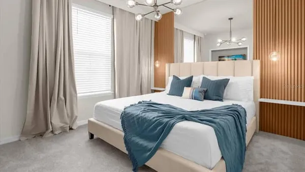 a view of balcony with two chairs and potted plants