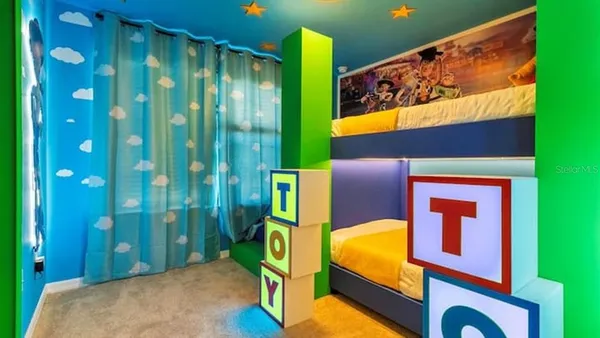a bedroom with a bed and a night stand