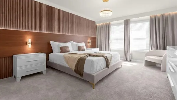 a bedroom with a bed and a cabinets