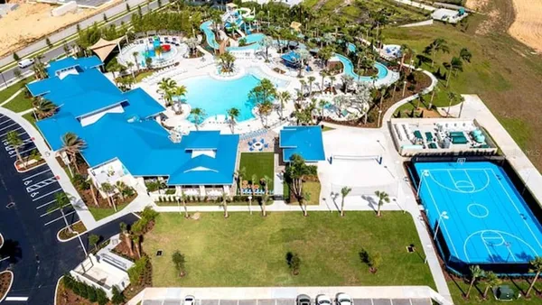 a swimming pool with outdoor seating yard and barbeque oven