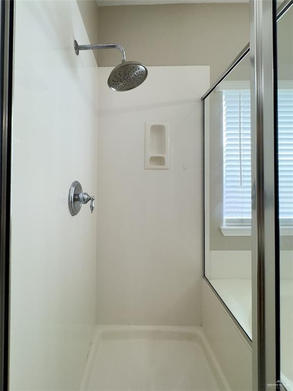 3402 San Sebastian Street Mission, TX 78572 - Photo 13 of 37 a bathroom with a shower