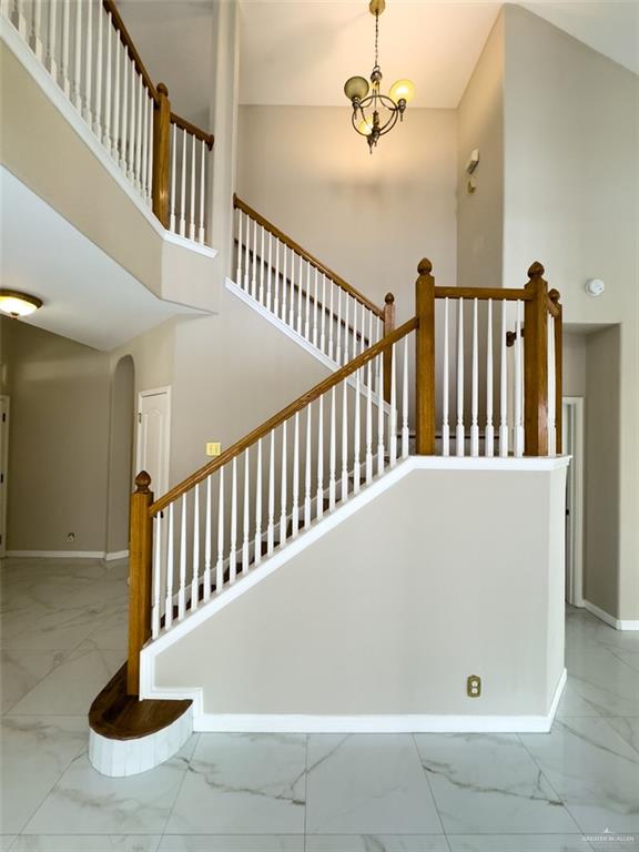 3402 San Sebastian Street Mission, TX 78572 - Photo 18 of 37 a view of staircase with lots of frames on wall and wooden floor