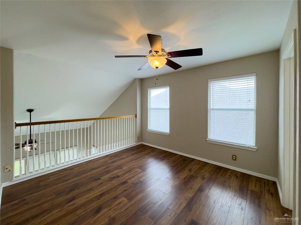 3402 San Sebastian Street Mission, TX 78572 - Photo 23 of 37 a view of an empty room with wooden floor and a window