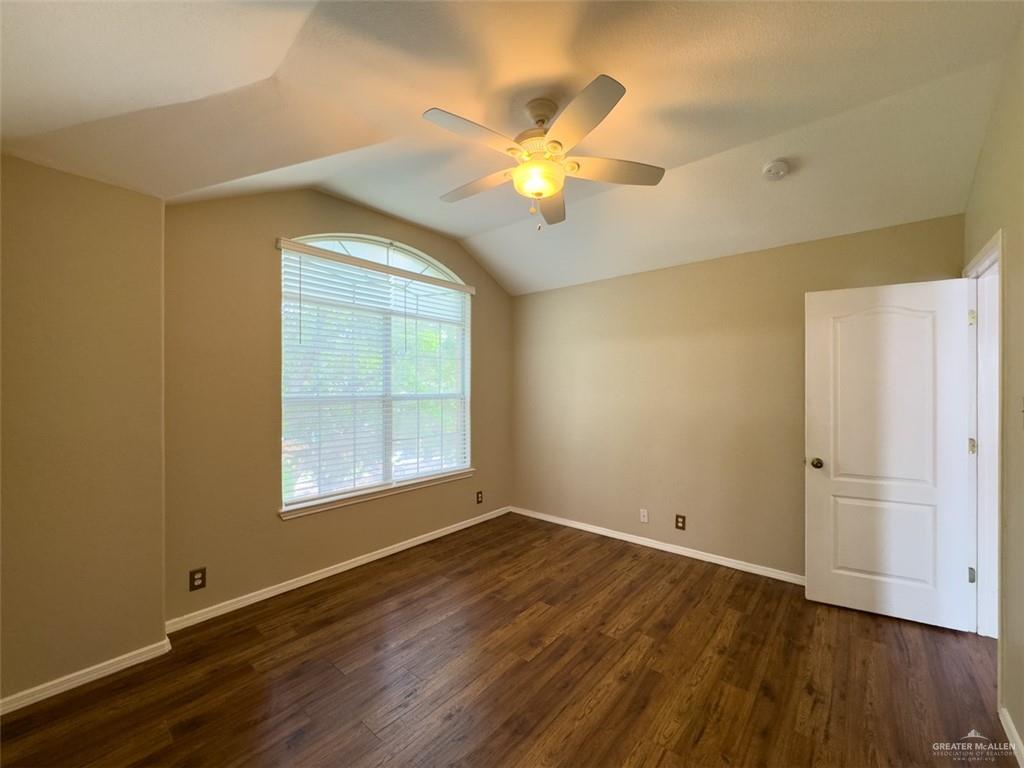 3402 San Sebastian Street Mission, TX 78572 - Photo 28 of 37 a view of an empty room with wooden floor and a window