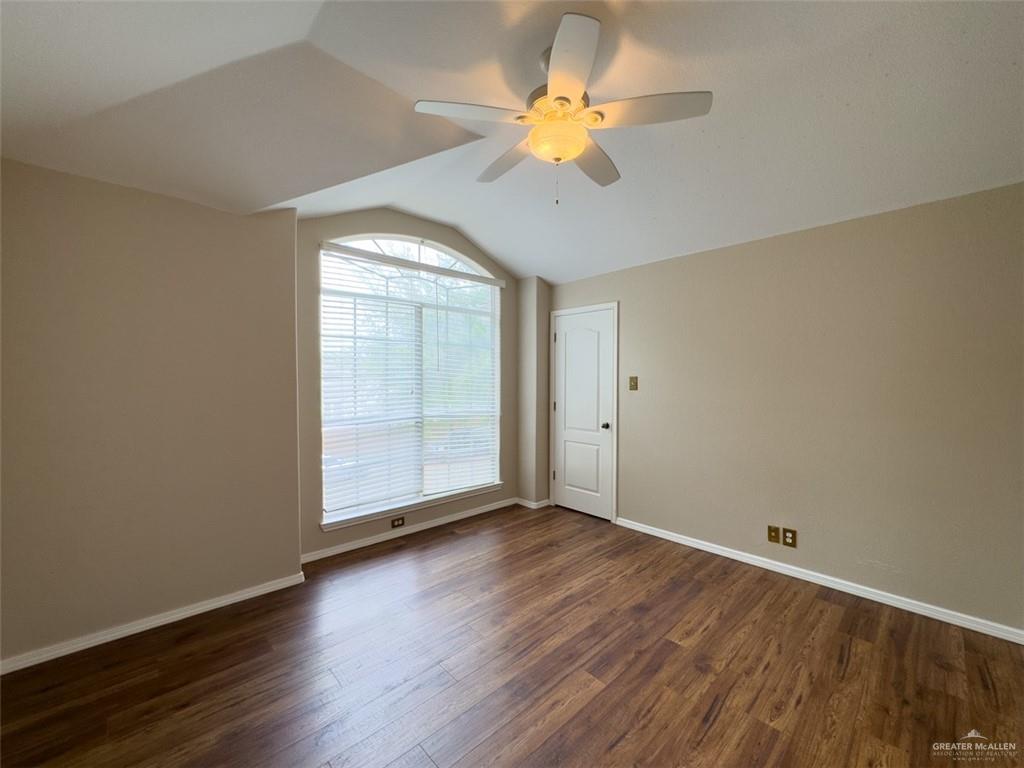 3402 San Sebastian Street Mission, TX 78572 - Photo 34 of 37 an empty room with wooden floor and windows