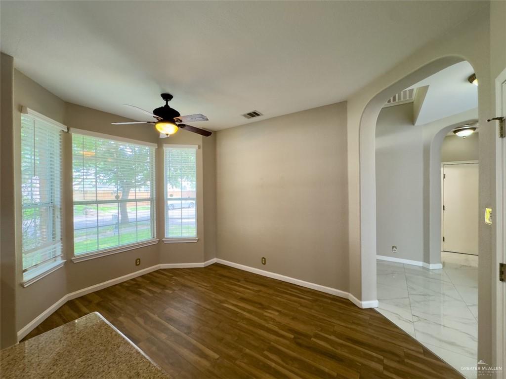 3402 San Sebastian Street Mission, TX 78572 - Photo 5 of 37 a view of an empty room with wooden floor and a window