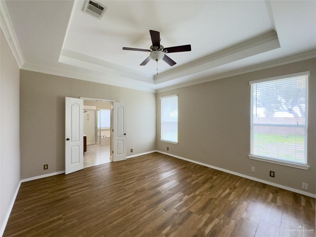 3402 San Sebastian Street Mission, TX 78572 - Photo 10 of 37 wooden floor in an empty room with a window