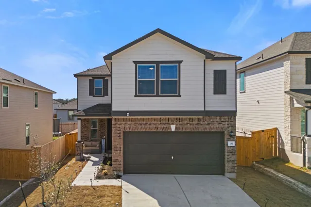 a front view of a house with a garage