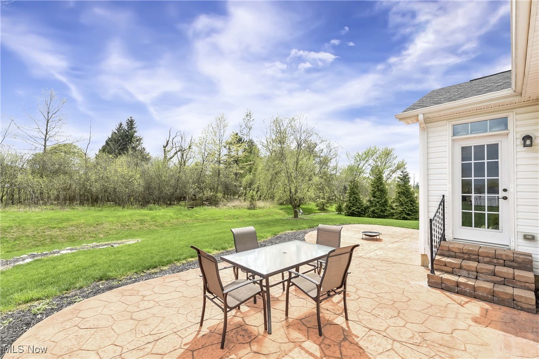 4614 Ridgestone Way Medina, OH 44256 - Photo 23 of 32 View of patio featuring outdoor dining area and entry steps