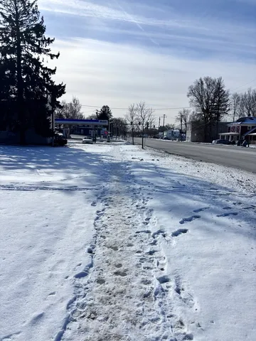 a view of road with view of residential houses
