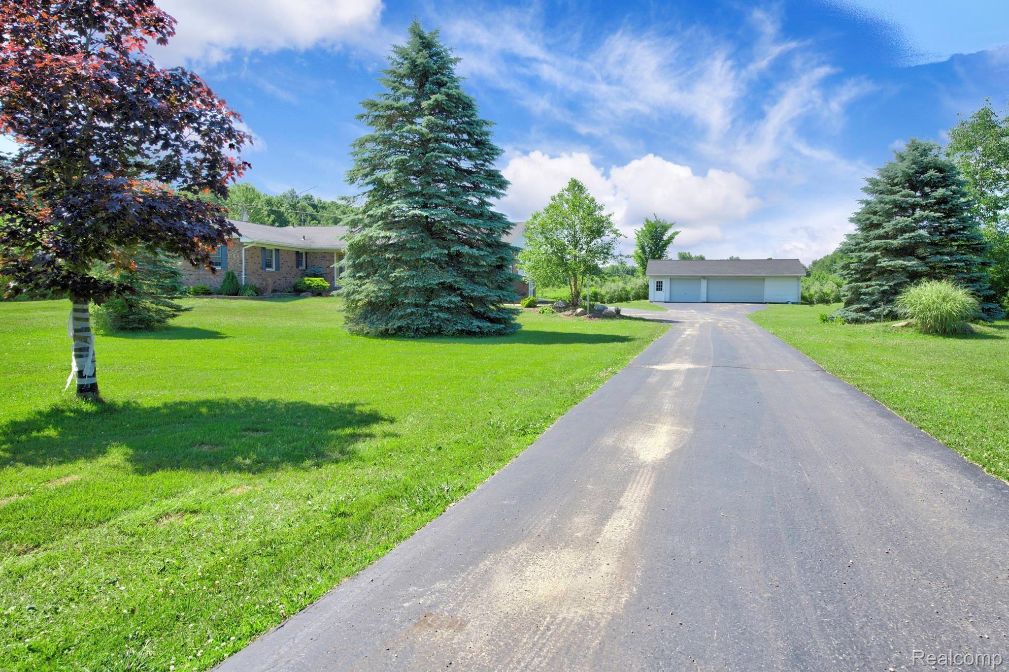 10575 West Sober Road Webberville, MI 48892 - Photo 3 of 46 ASPHALT DRIVE/3 CAR GARAGE AT THE END
