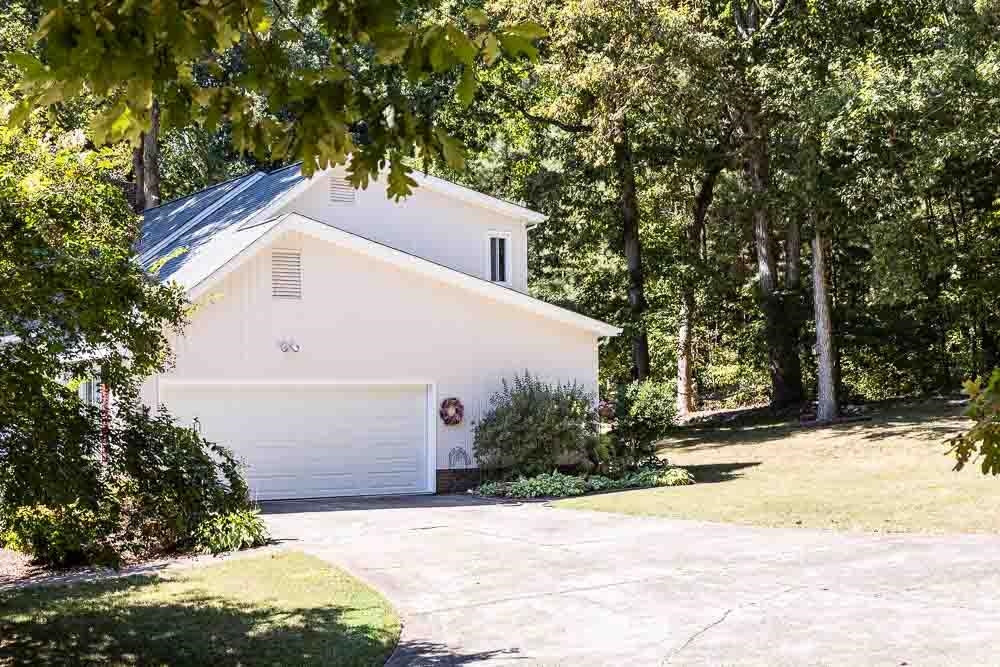 9513 Springdale Drive Raleigh, NC 27613 - Photo 29 of 30 2 Car Garage with Extra Parking Pad