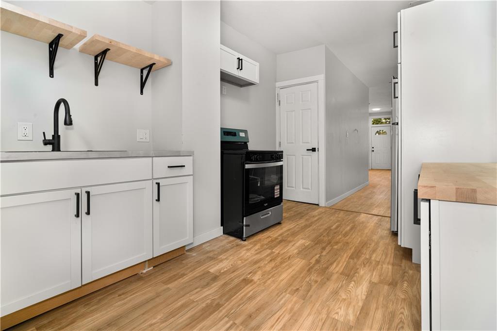308 North Millvale Avenue Pittsburgh, PA 15224 - Photo 12 of 27 a kitchen with a refrigerator and a sink