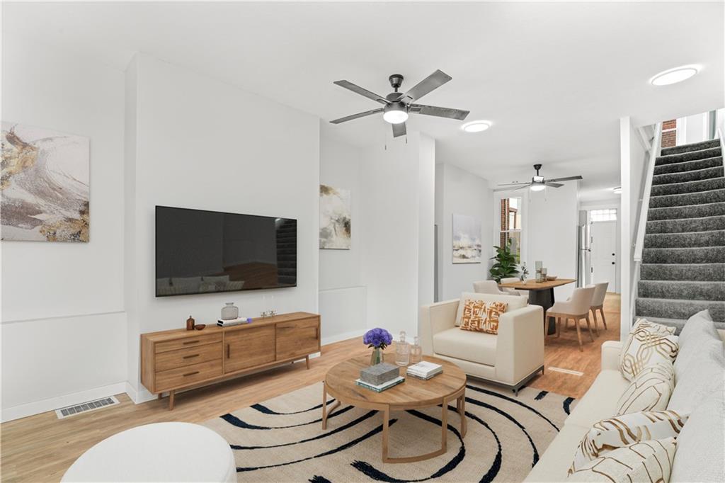 308 North Millvale Avenue Pittsburgh, PA 15224 - Photo 3 of 27 a living room with furniture and a flat screen tv