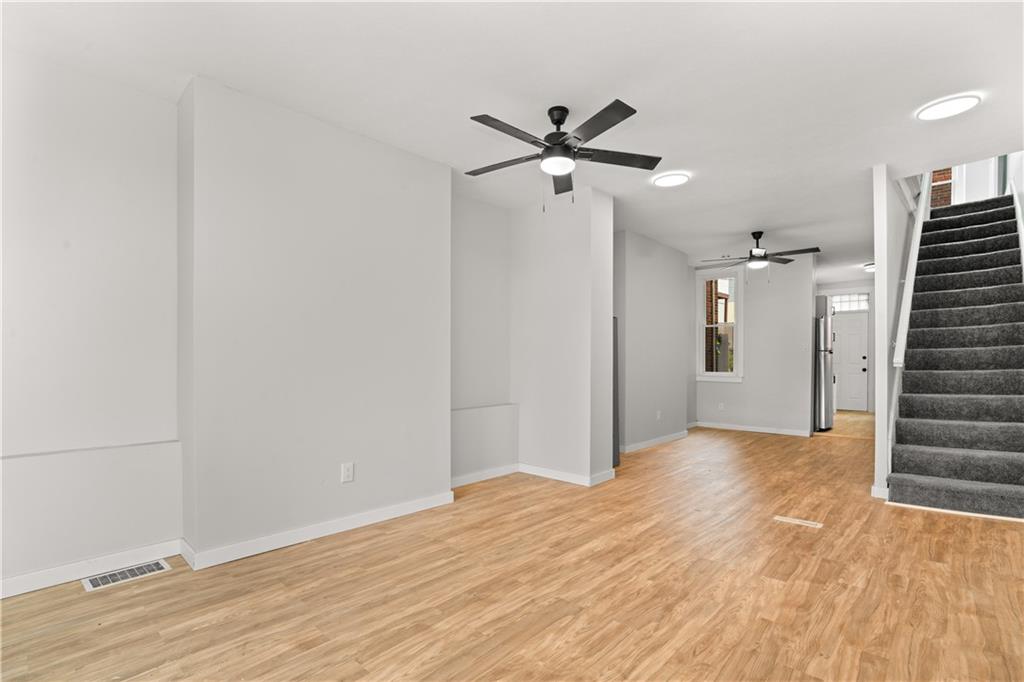 308 North Millvale Avenue Pittsburgh, PA 15224 - Photo 4 of 27 a view of a big room with wooden floor and closet