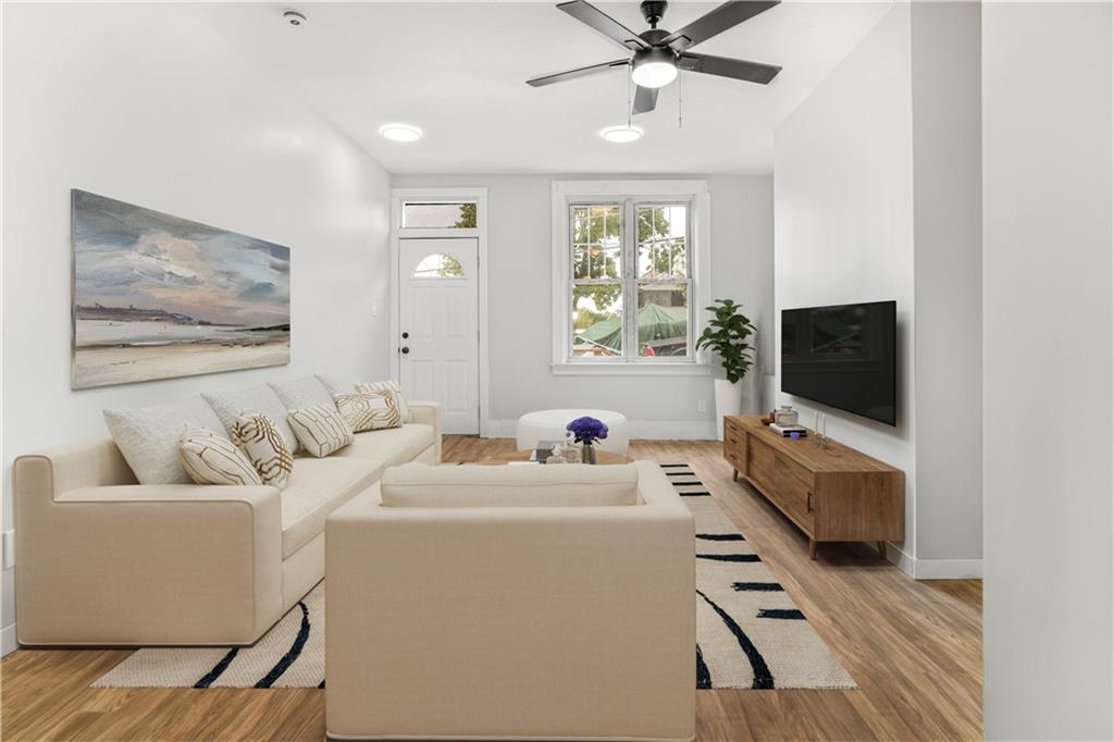 308 North Millvale Avenue Pittsburgh, PA 15224 - Photo 7 of 27 a living room with furniture and a flat screen tv