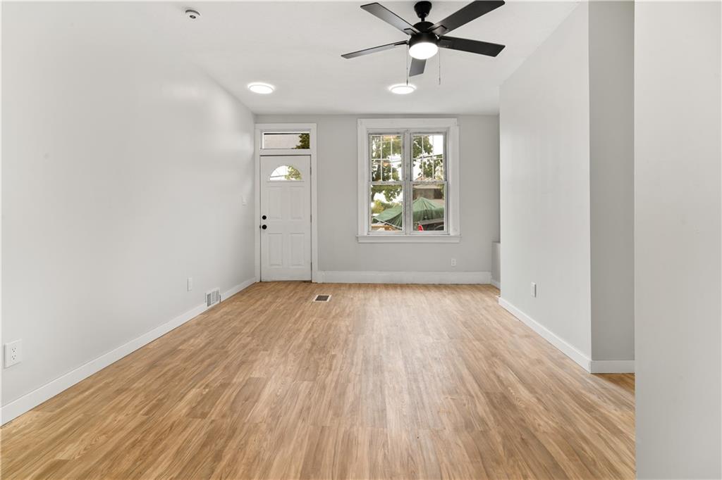 308 North Millvale Avenue Pittsburgh, PA 15224 - Photo 8 of 27 wooden floor in an empty room with a window