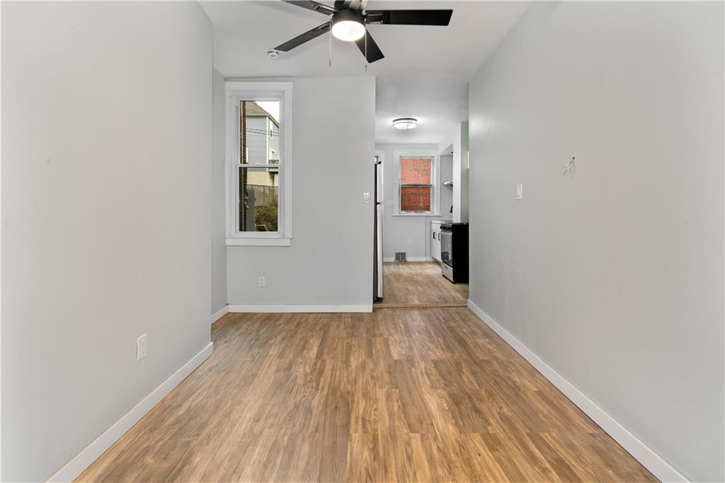 308 North Millvale Avenue Pittsburgh, PA 15224 - Photo 10 of 27 wooden floor in an empty room with a window