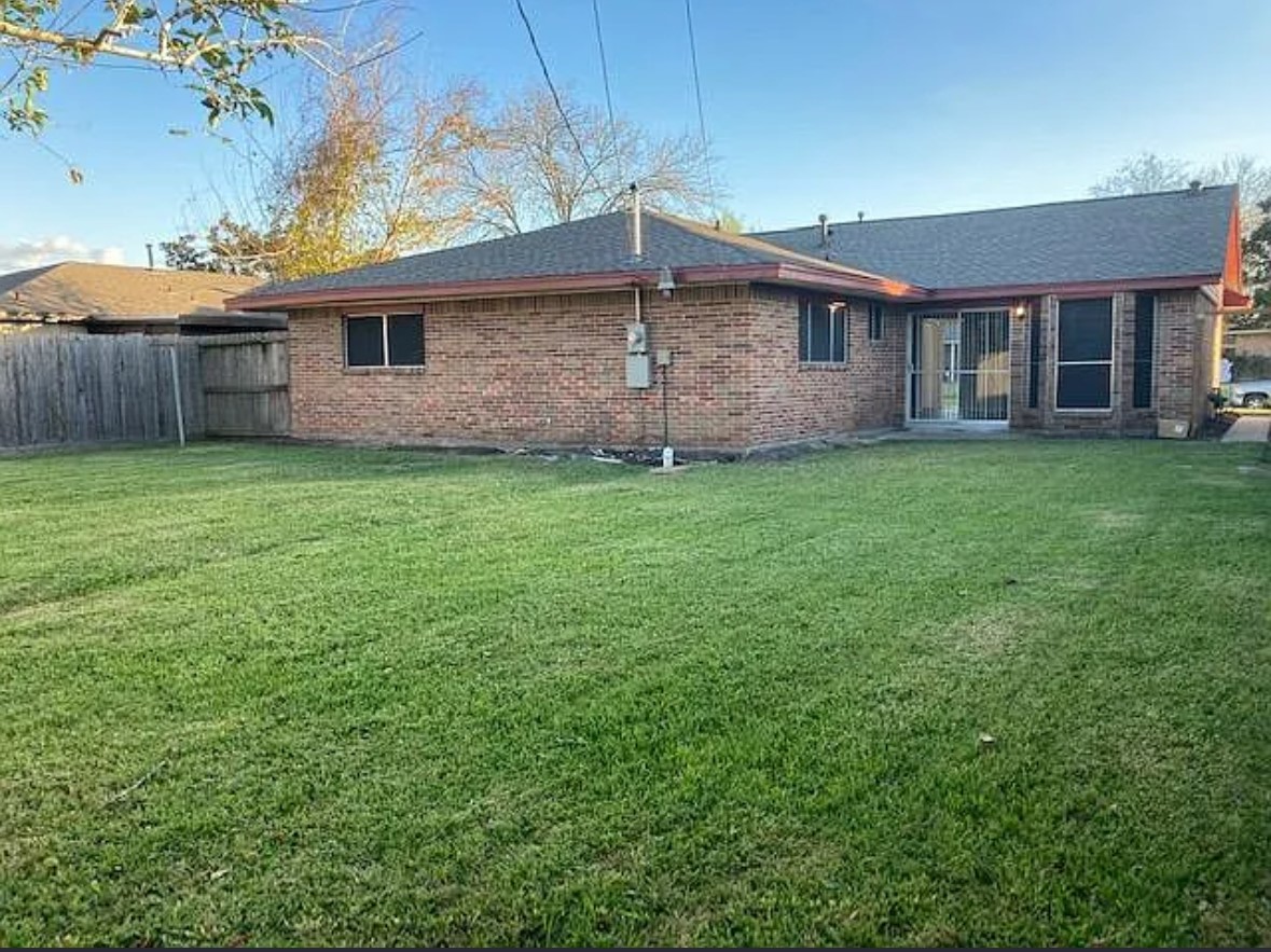 4015 Marchant Road Houston, TX 77047 - Photo 14 of 15 a backyard of a house with seating space