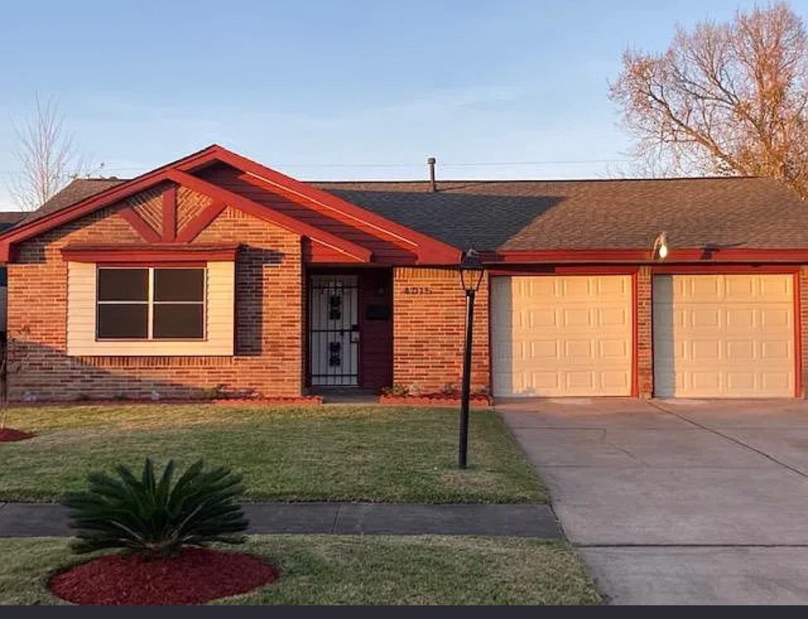 4015 Marchant Road Houston, TX 77047 - Photo 2 of 15 a front view of a house with garden