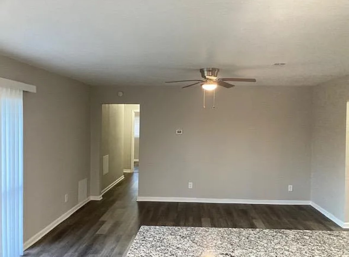 4015 Marchant Road Houston, TX 77047 - Photo 7 of 15 a view of a room with a window and wooden floor