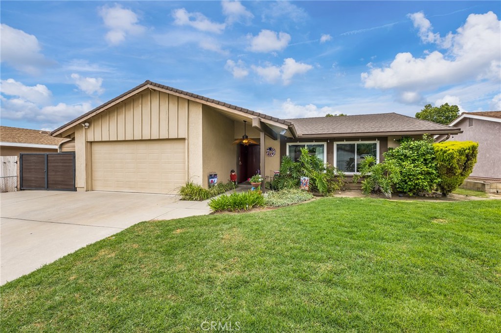 2073 Suede Avenue Simi Valley, CA 93063 - Photo 1 of 33 a front view of house with yard and green space